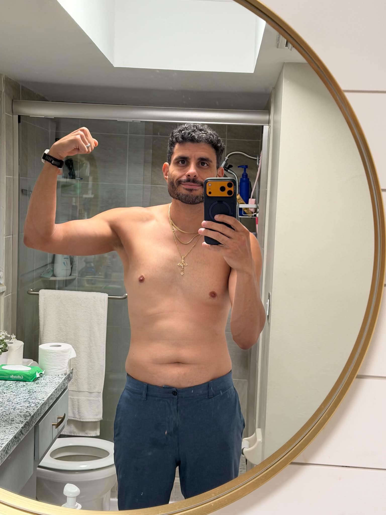 Hector flexing his arm during a progress check-in
