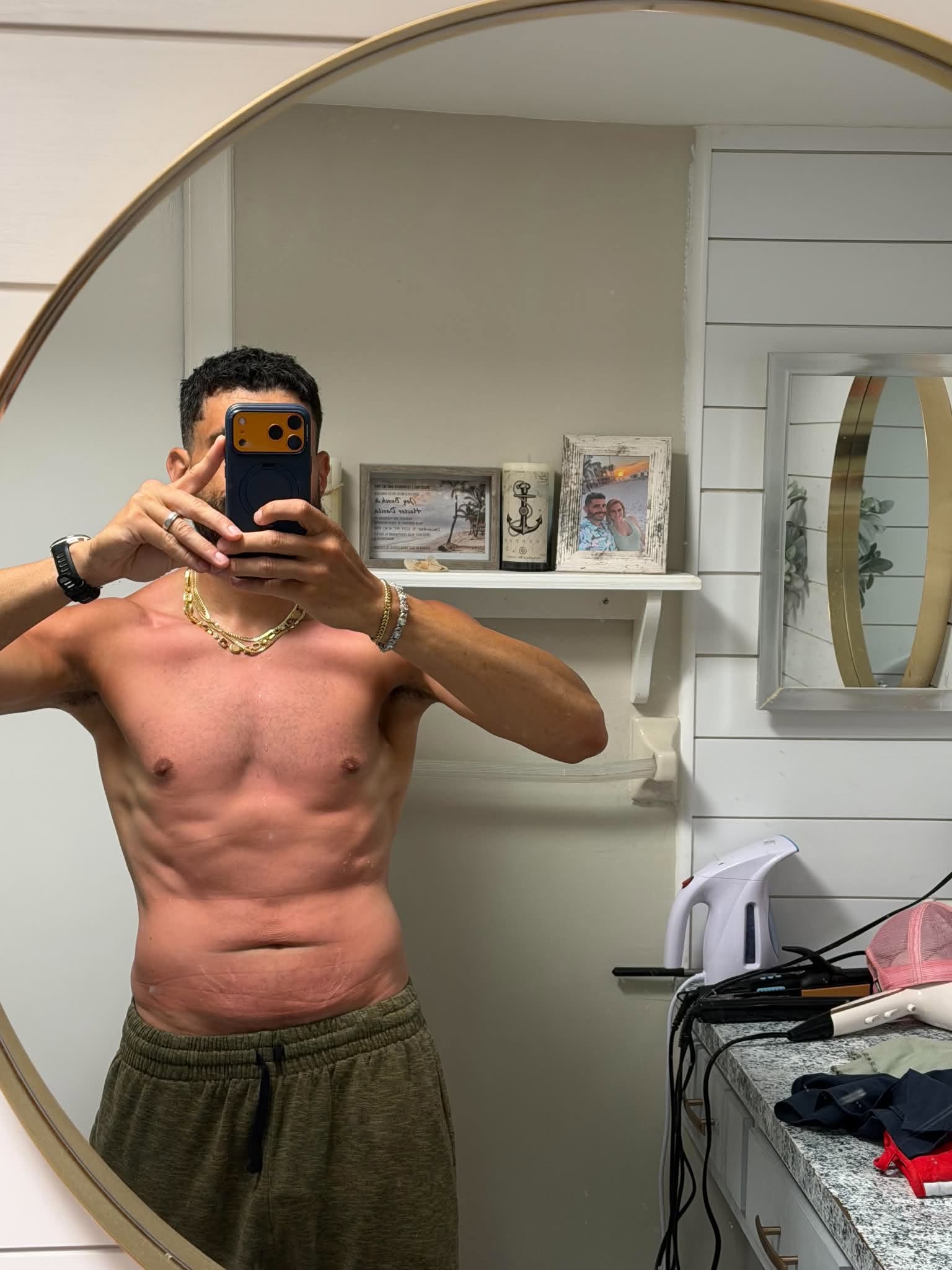Hector’s progress photo in green shorts